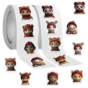 Close-up detail of cute cartoon animal stickers roll featuring adorable knitted hat portraits.