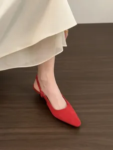 Red suede pointed slingback low heel shoes detail view showing elegant French retro style.