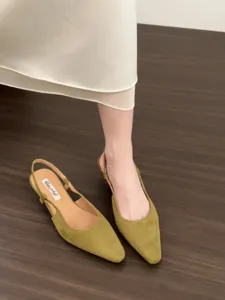 Detailed view of women elegant pointed toe slingback low heel sandals in chic olive green suede.