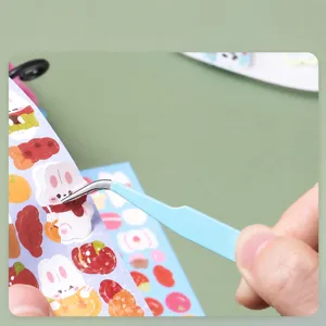 Blue stainless steel curved tweezers for DIY journal stickers, 3D scenery craft handmade tool.