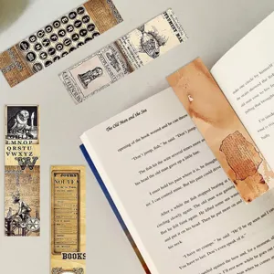 Vintage paper bookmarks detail showing retro typewriter and botanical illustrations.
