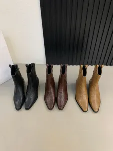 Detailed view of women's retro pointed toe chunky heel western short boots in three colors.