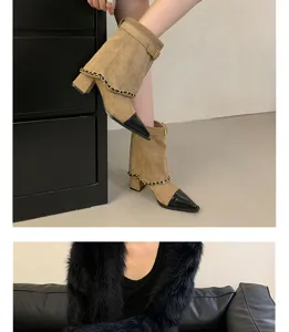 Detailed view of women's pointed-toe mid-heeled short boots featuring chic chain accent.