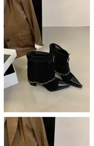 Black suede pointed-toe ankle boots detail featuring chic metal chain and comfortable block heel.
