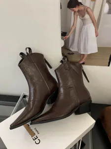 Dark brown pointed toe block heel western boots for women, stylish vintage design view.