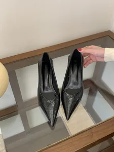Black pointed toe kitten heels for women, stylish glossy leather dress shoes for daily wear.
