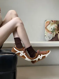Women's casual leather sneakers retro flat retro trainers stylish brown footwear detail view