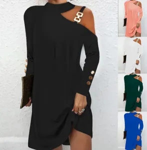 Women cold shoulder long sleeve dress with metal chain halter neck and button cuff detail.