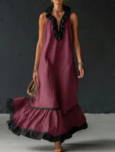 Detail view of the elegant sleeveless V-neck maxi dress with chic black ruffles.