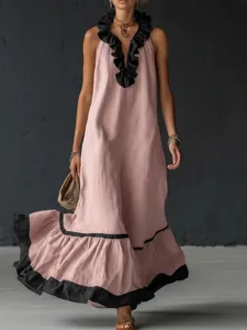 Detailed view of the sleeveless V-neck pink long dress featuring stylish black ruffles.