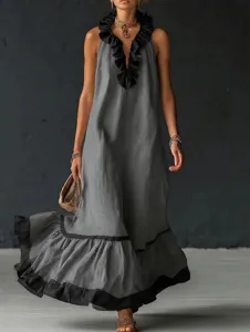 Sleek grey sleeveless V-neck long maxi dress featuring elegant black ruffle trim details.