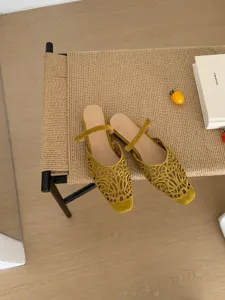 French vintage style yellow suede cut-out square toe flats with delicate ankle strap detail.