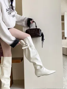 White knee-high boots women low heel square toe chic fashion stylish footwear detail shot