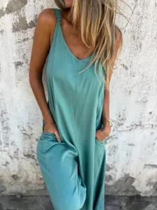 Detailed view of casual loose cotton linen jumpsuit with practical side pockets and straps.