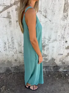 Women's casual solid color sleeveless cotton linen loose jumpsuit with side pockets side view