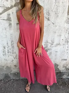 Detailed view of women's solid color linen blend sleeveless casual jumpsuit with pockets.