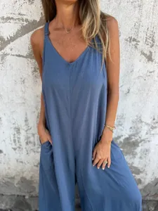 Close-up detail of the casual blue cotton-linen jumpsuit showing relaxed fit and pocket design.