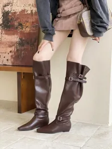 Stylish dark brown slouchy knee-high boots with square toe and low flat heel for women.