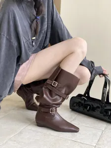 Stylish women's brown flat boots with square toe and double buckle straps for daily autumn wear.