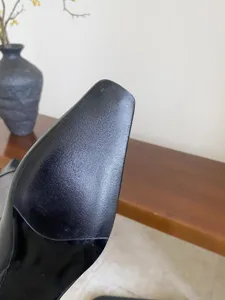 Detail shot of women's black boots square toe textured sole fashion footwear close up