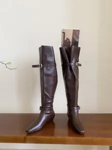 Detail view of dark brown square toe low heel over-the-knee boots with stylish buckle strap.