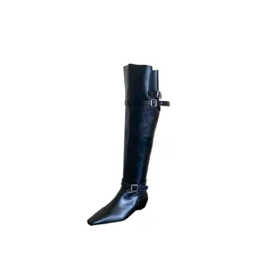 Black square toe low heel tall boots for women with stylish metal buckle strap details.