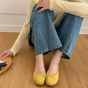 Comfortable yellow velvet flat ballet shoes with cute bow design, perfect for casual daily wear.