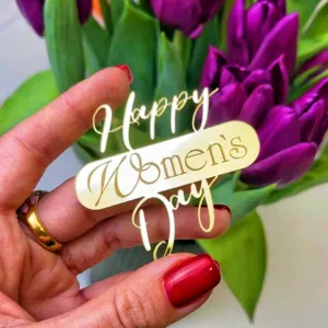 Gold acrylic Happy Women's Day cake topper for party celebration and baking decoration.