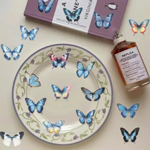 Transparent waterproof blue butterfly stickers for journaling, phone and laptop decoration.