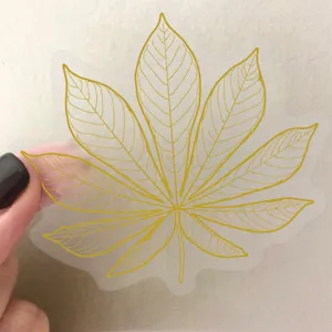 Close-up detail of clear PET gold foil leaf sticker, perfect for journal and phone decoration.