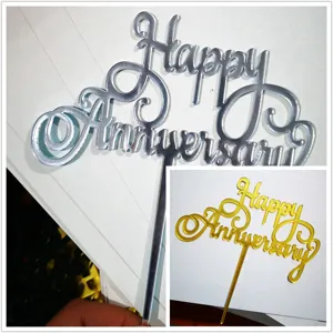 Acrylic anniversary cake topper detail showing reflective texture and elegant cursive typography.
