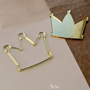 Gold acrylic crown cake topper detail, elegant dessert decoration for birthday party.