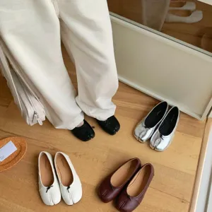 French split-toe ballet flats, minimalist chic slip-on shoes, comfortable everyday casual footwear.