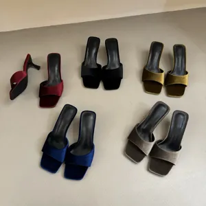 Detailed view of velvet square toe high heeled mules in multiple colors, elegant and stylish.