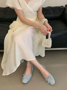 Elegant light blue flat ballet shoes with sweet bow, square toe design for women comfort.