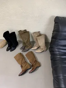 French pointed toe mid-calf slouch boots detailed view showing multiple color options.