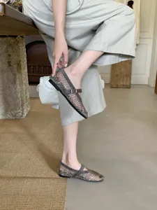 Detail view of women's grey mesh flat shoes, ballet style with strap, comfortable everyday wear.