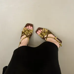 Detailed view of women's French square toe braided velvet sandals with thin straps and low heel.