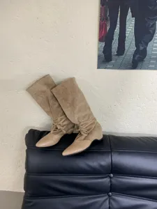 Stylish pointed toe mid-calf boots with slouchy design, elegant women fashion footwear.