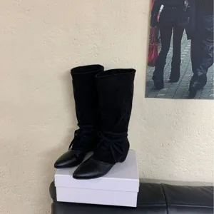 Black pointed toe wedge mid calf slouchy boots for women, stylish French design footwear.