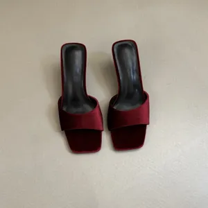 Burgundy velvet square toe high heel mule shoes detail, elegant design and smooth texture.