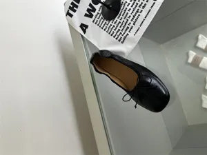 Classic black flat ballet shoes for women, stylish square toe design with delicate bow.