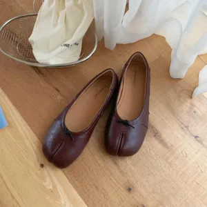 Detailed view of dark brown split toe tabi ballet flat shoes with chic front bow knot.