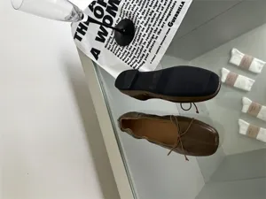 Retro flat ballet shoes for women, shallow mouth design with cute bow tie, brown soft leather.