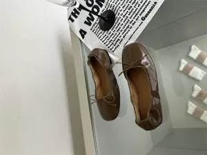 Retro soft leather flat ballet shoes detail shot, comfortable shallow cut women slip-on shoes.