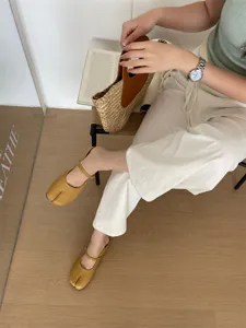 Split-toe Mary Jane shoes for women, stylish yellow flat slip-on footwear, comfortable daily wear.