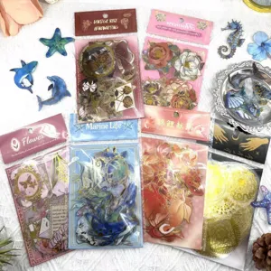 Detailed display of gold stamping PET waterproof transparent stickers, various journaling designs.