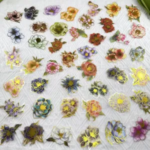 Detailed close-up view of PET transparent gold foil floral stickers for DIY journals.