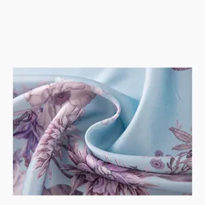 Luxurious mulberry silk satin square scarf fabric close-up showcasing elegant floral print.
