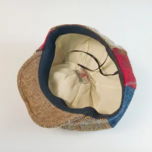 Handcrafted Harris Tweed newsboy cap interior detail, 100% pure wool British style.